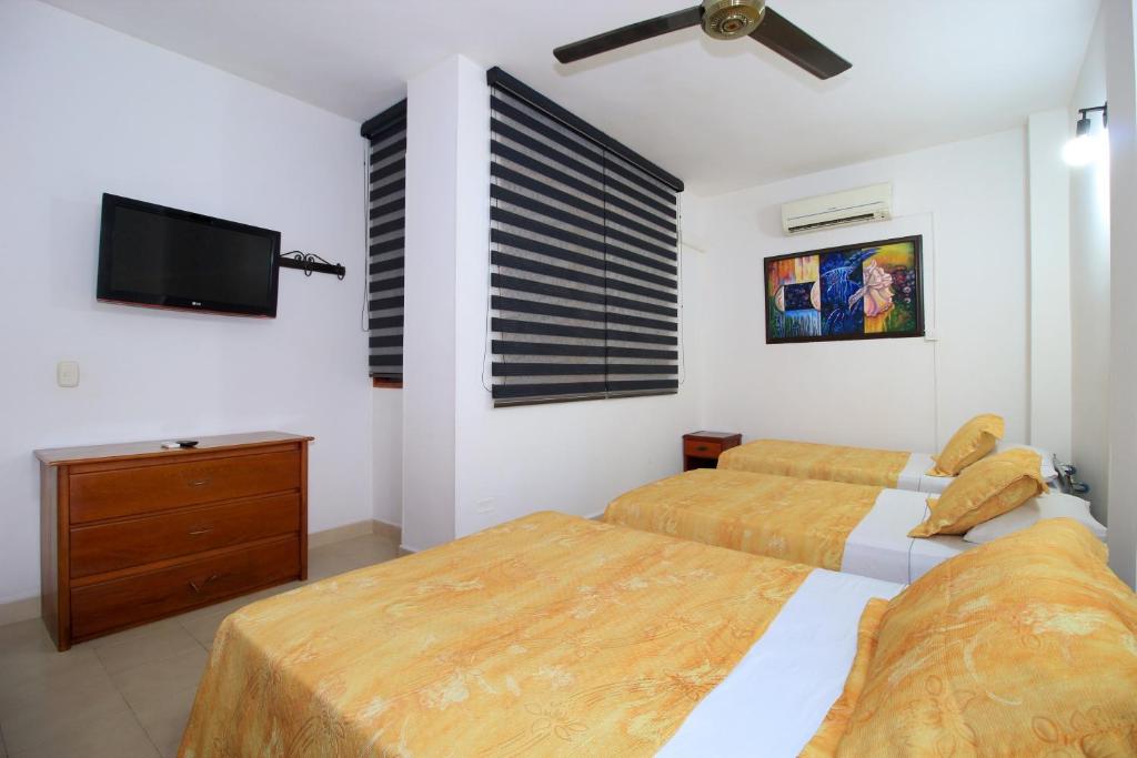 Postel nebo postele na pokoji v ubytování Hotel Emberá