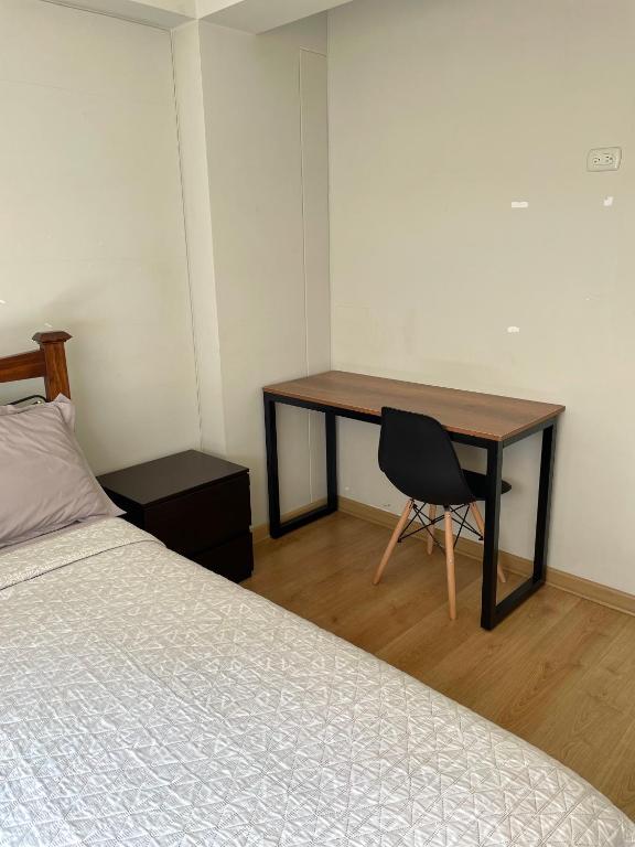 Postel nebo postele na pokoji v ubytování Departamento Compartido San Isidro