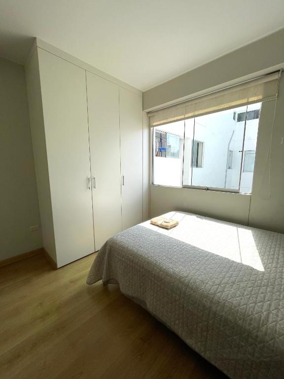 Postel nebo postele na pokoji v ubytování Departamento Compartido San Isidro