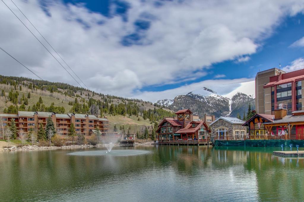 a resort with a fountain in the middle of a lake at Village Square in Copper Mountain