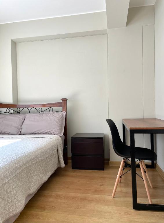 Postel nebo postele na pokoji v ubytování Departamento Compartido San Isidro