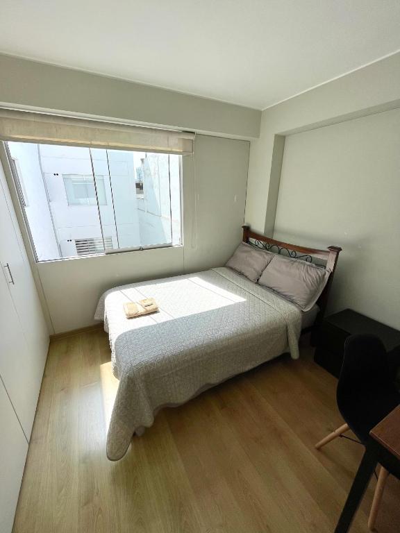 Postel nebo postele na pokoji v ubytování Departamento Compartido San Isidro