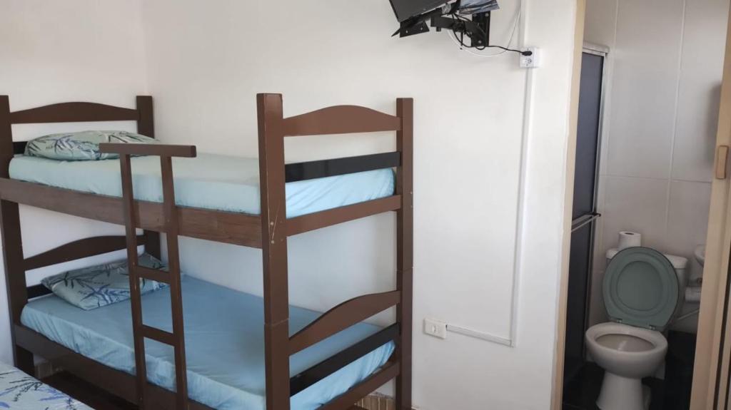 Postel nebo postele na pokoji v ubytování Pousada Do Léo