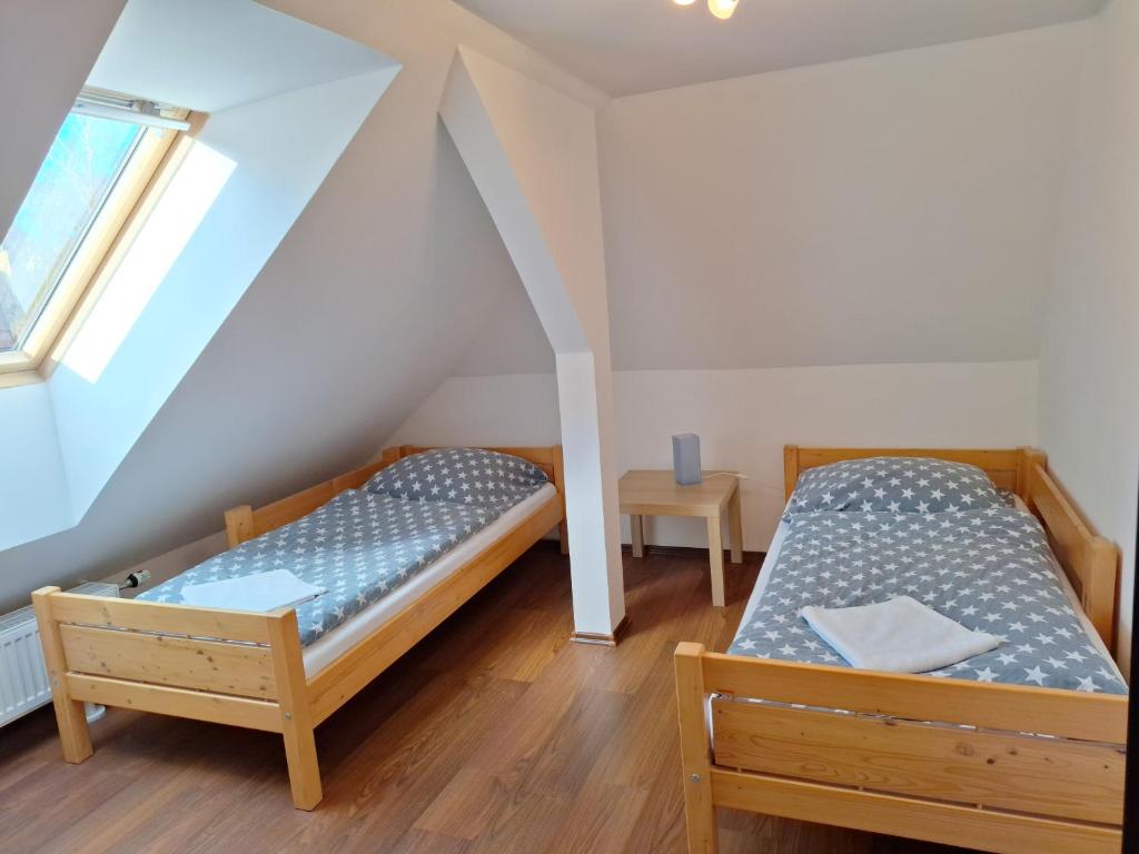 Postel nebo postele na pokoji v ubytování Apartmány Paseky - Jablonec nad Nisou