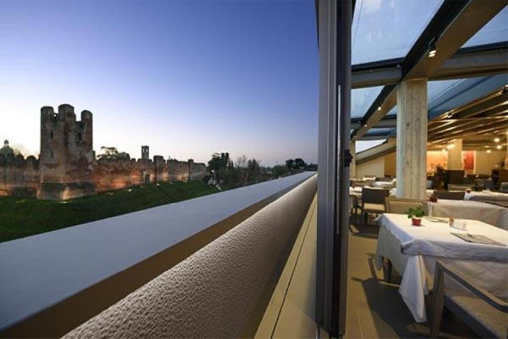 a view of a castle from the balcony of a building at Albergo Roma, BW Signature Collection in Castelfranco Veneto