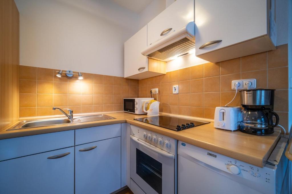 Kuchyň nebo kuchyňský kout v ubytování Apartment Riviera 500-15 Lipno Home