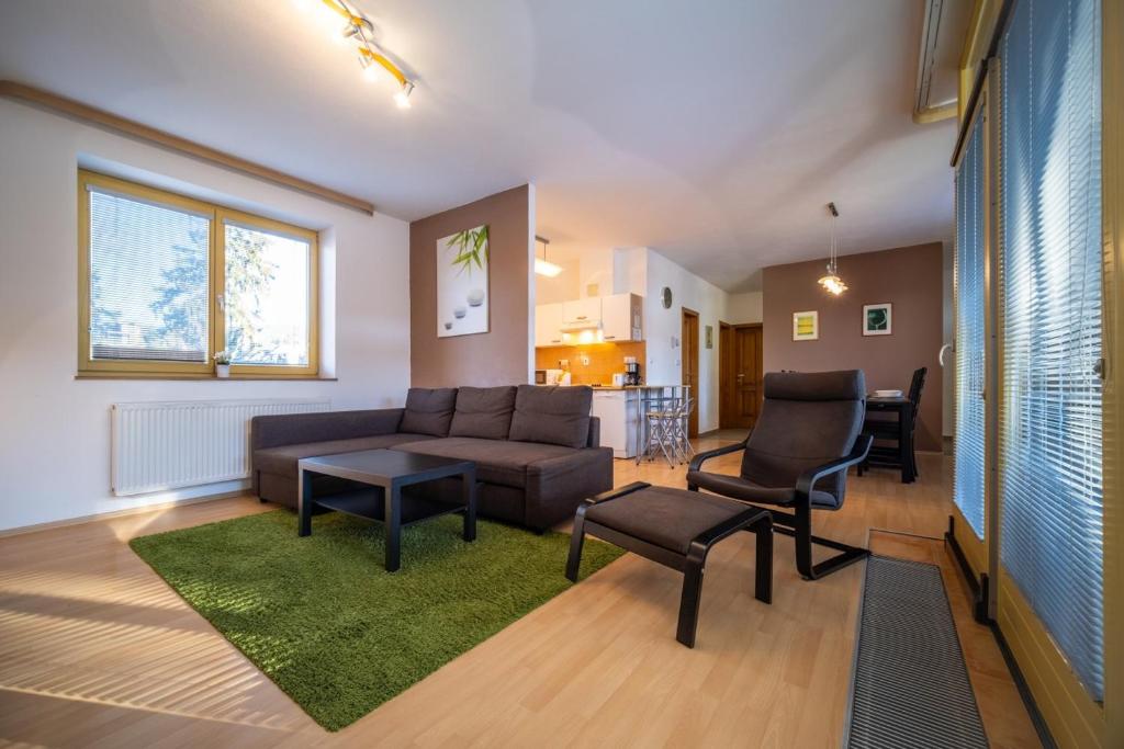 Posezení v ubytování Apartment Riviera 500-15 Lipno Home