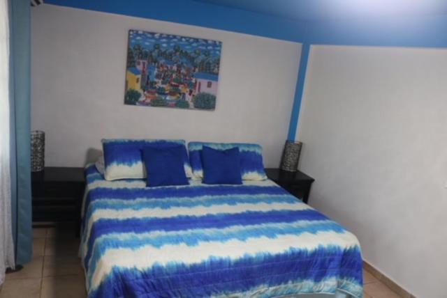 Postel nebo postele na pokoji v ubytování Uverito Sand Dollar B&B