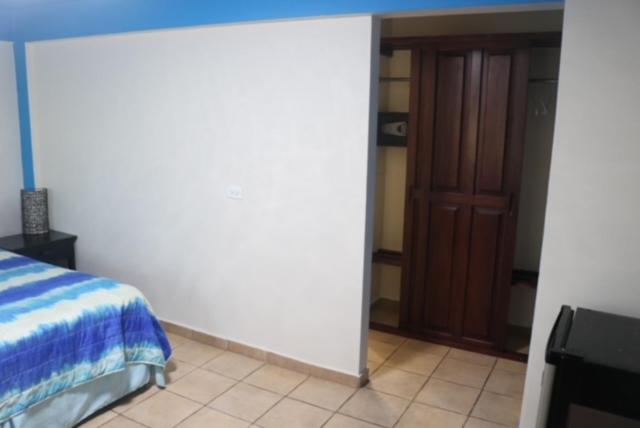 Postel nebo postele na pokoji v ubytování Uverito Sand Dollar B&B