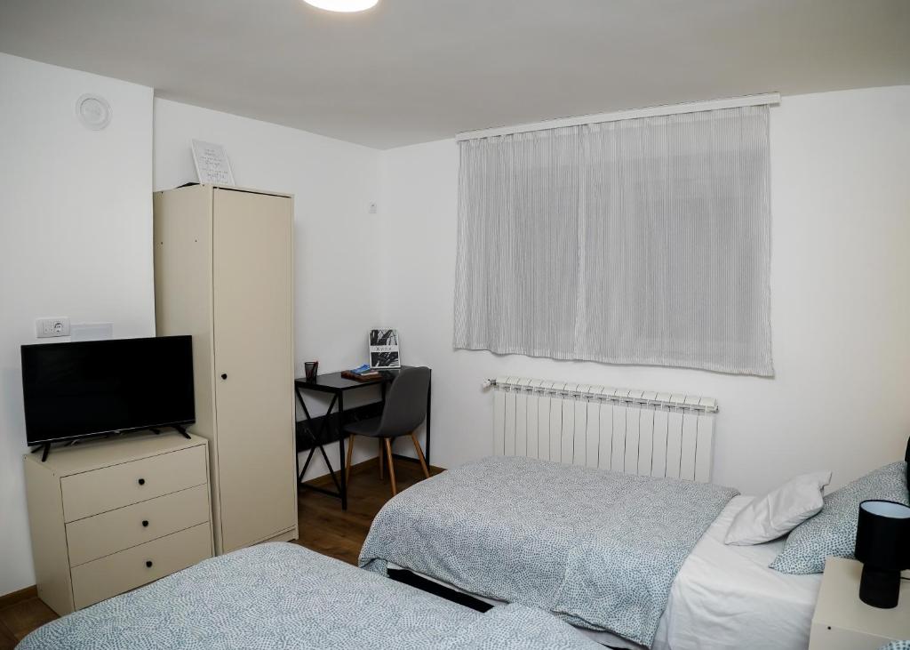 Postel nebo postele na pokoji v ubytování Mitrovića kuća