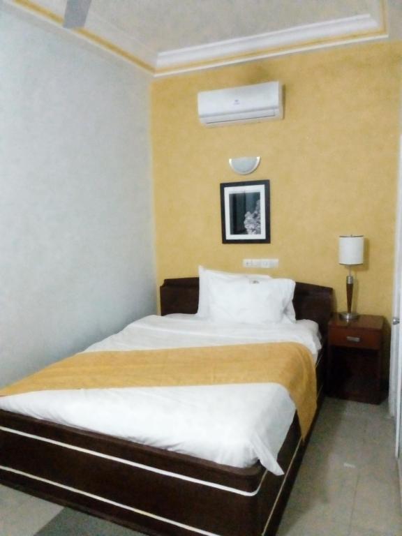 Postel nebo postele na pokoji v ubytování EKA ELITE HOTEL