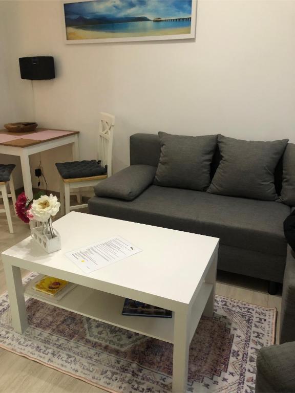 a living room with a couch and a coffee table at Ferienwohnung Just City in Wismar