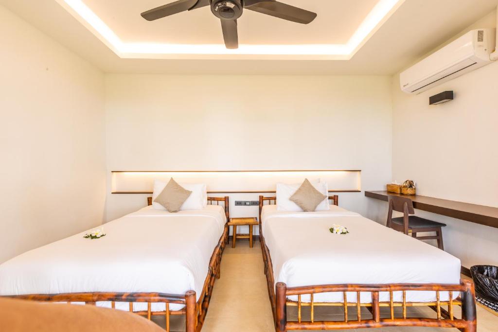 Postel nebo postele na pokoji v ubytování Phukhaolak Resort