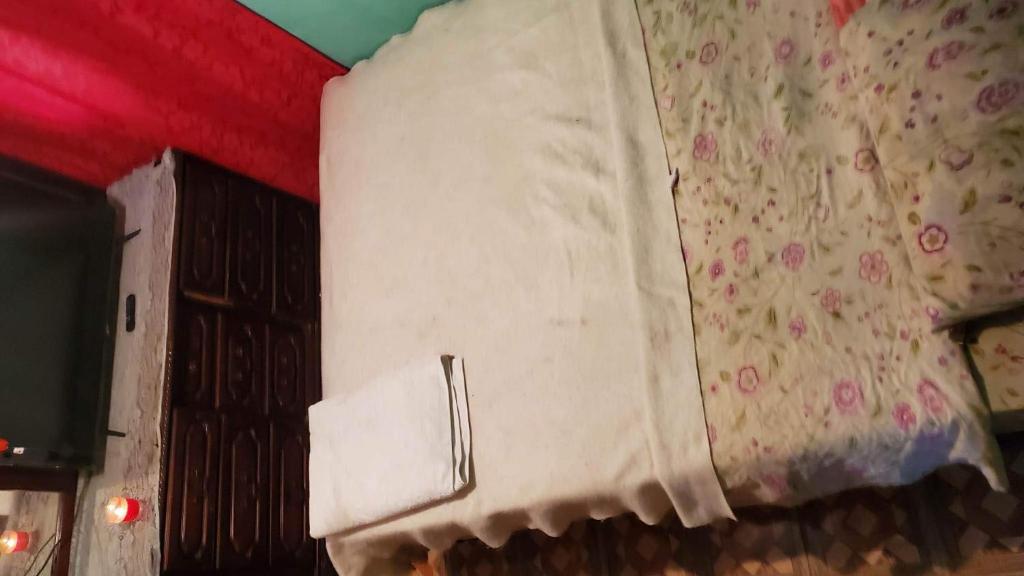 En eller flere senge i et værelse på J&L Mountainside Retreat Family HQ