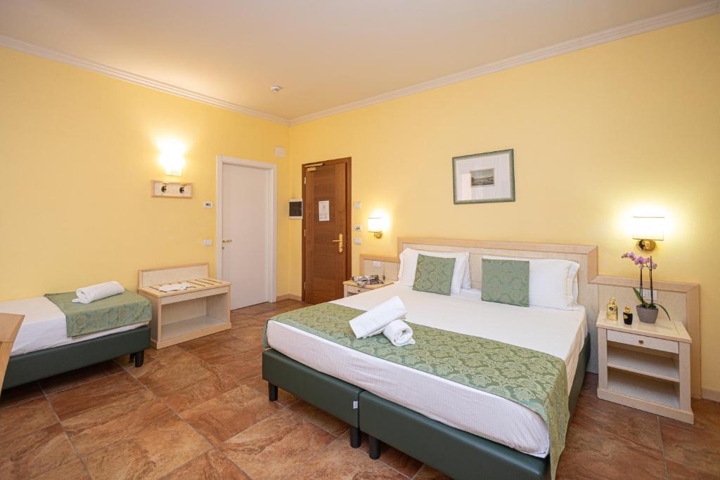 Postel nebo postele na pokoji v ubytování Hotel Belvedere San Gottardo by LVG Hotel Collection