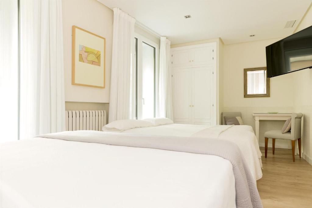 Postel nebo postele na pokoji v ubytování Hotel Sauce