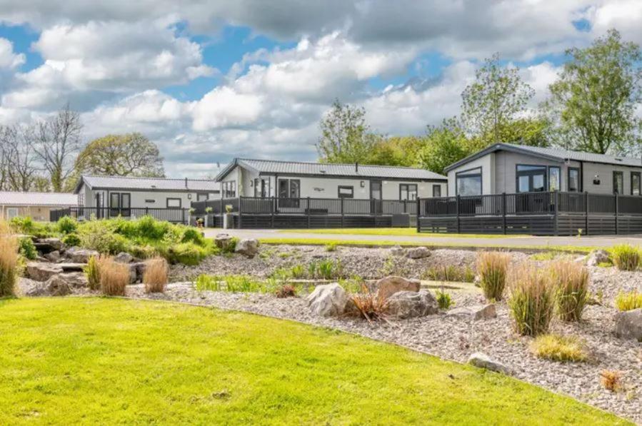 a house with a garden in front of it at Ribble Valley Country and Leisure Park 