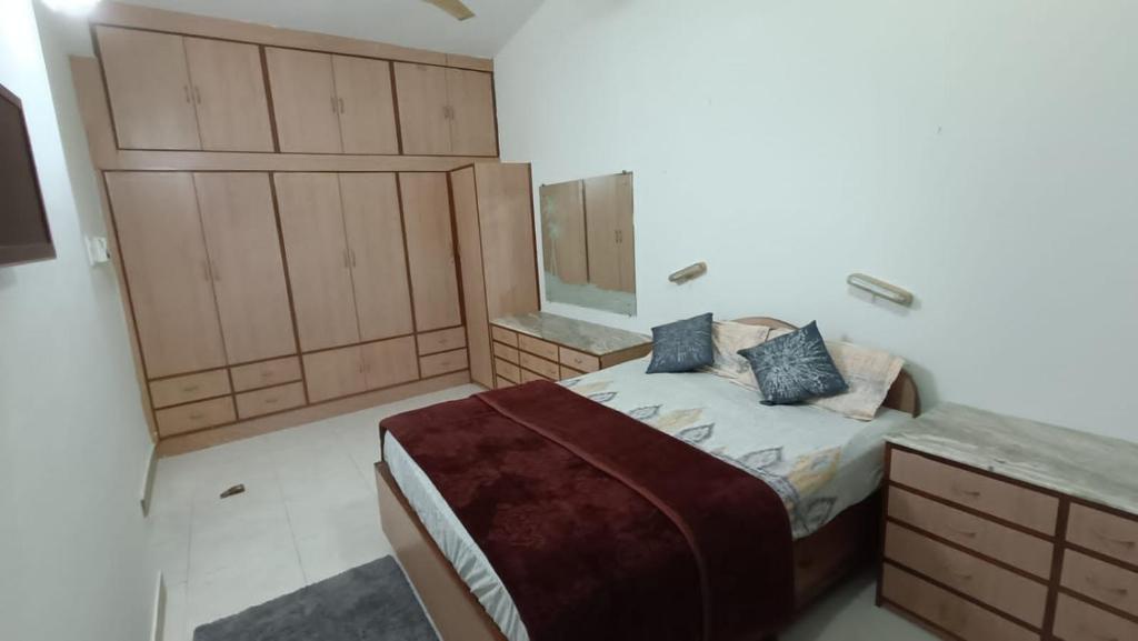 a small bedroom with a bed and a counter at Bungalow at Porvorim, Panaji in Panaji