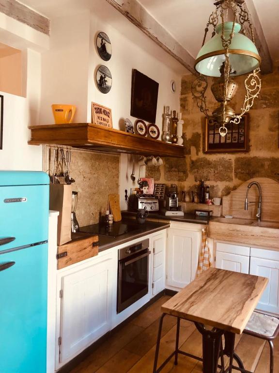 Kuchyň nebo kuchyňský kout v ubytování Appartement des Sablons