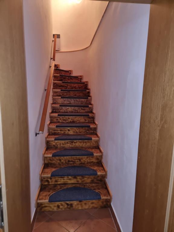 a stairway with blue cushions on the stairs at Chata Hrabovo in Ružomberok