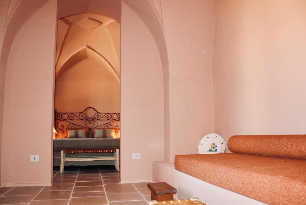 Postel nebo postele na pokoji v ubytování Antica Masseria le Monache
