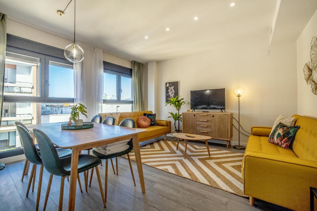 A television and/or entertainment centre at Costasol33 Aptos 1 y 2