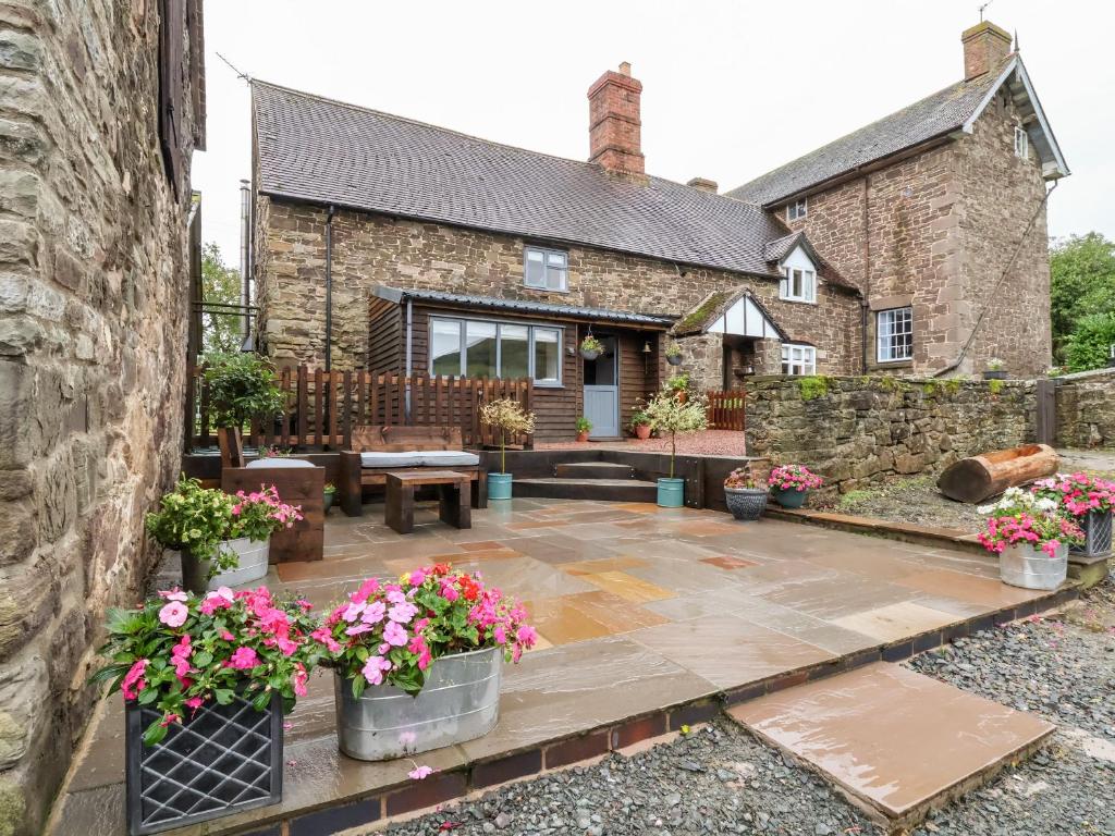 an external view of a house with a patio at The Brewhouse in Church Stretton