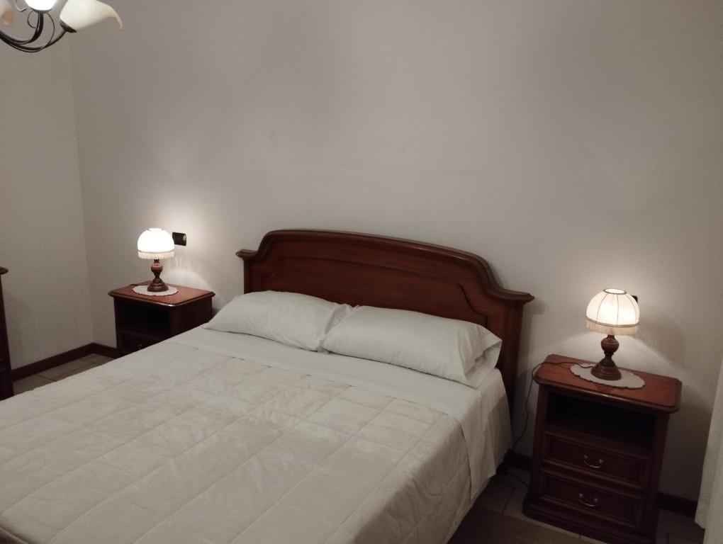 Postel nebo postele na pokoji v ubytování Fattoria I Canarini