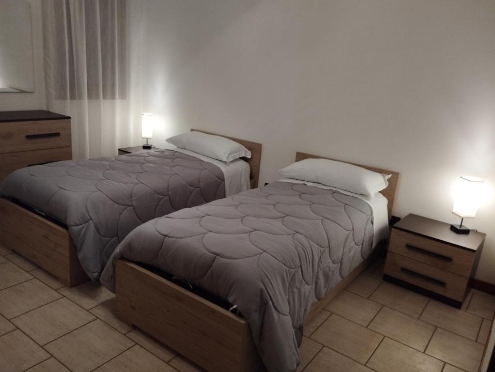 Postel nebo postele na pokoji v ubytování Fattoria I Canarini