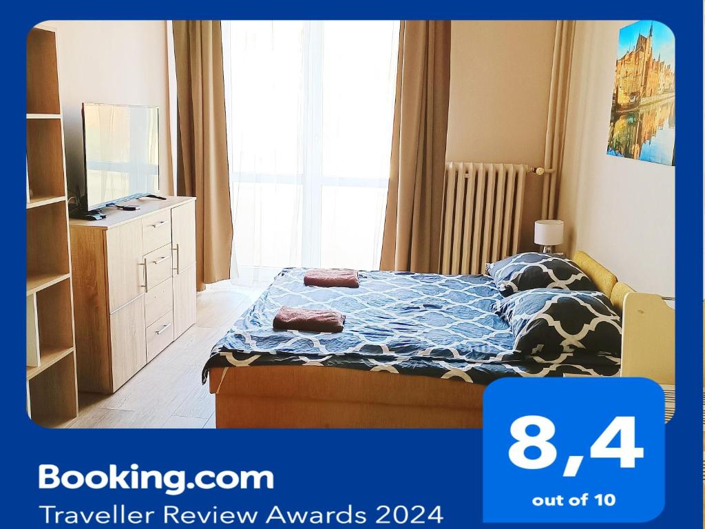 En eller flere senge i et værelse på Bon Voyage Apartments