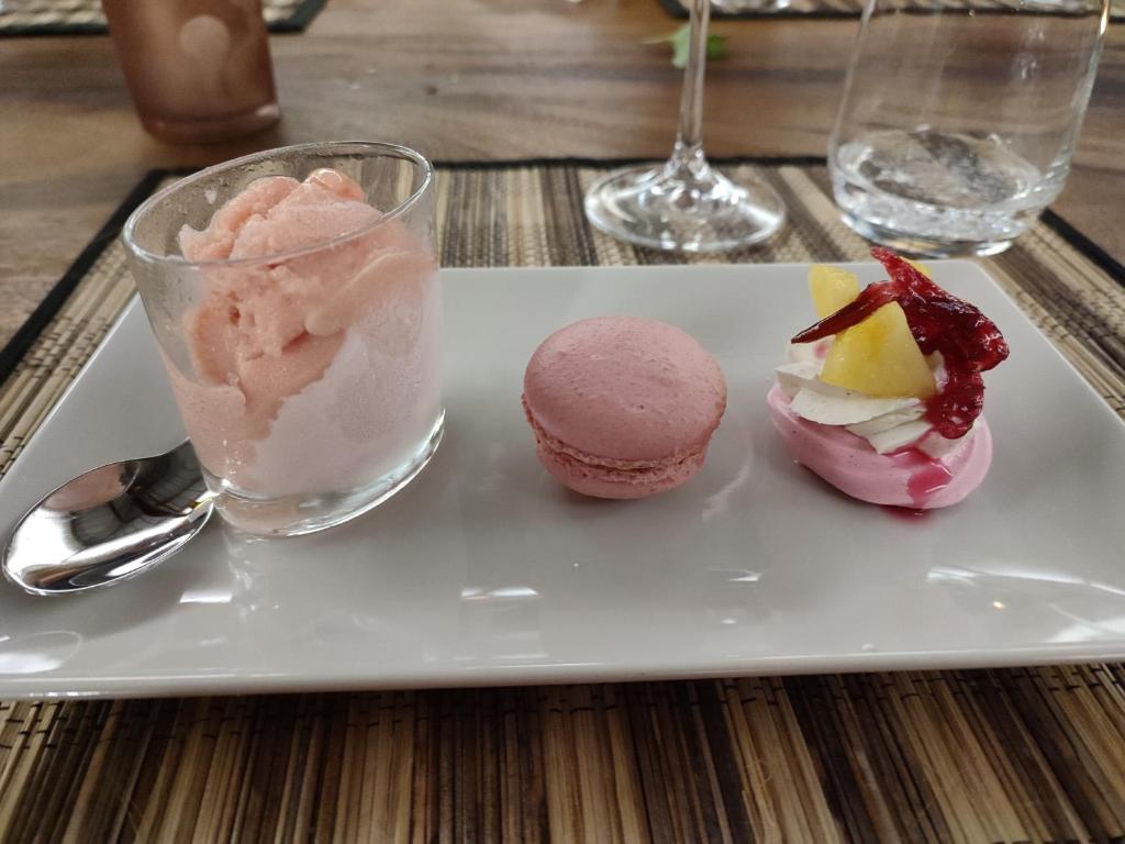 a plate with three different desserts on a table at VillAnolis Martinique in Le Carbet