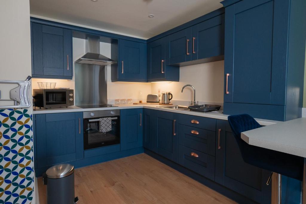 Kuchyň nebo kuchyňský kout v ubytování The Links Suites