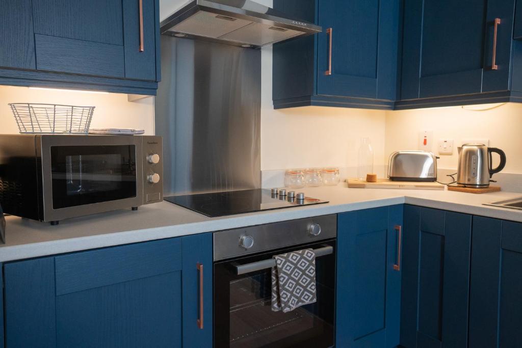 Kuchyň nebo kuchyňský kout v ubytování The Links Suites