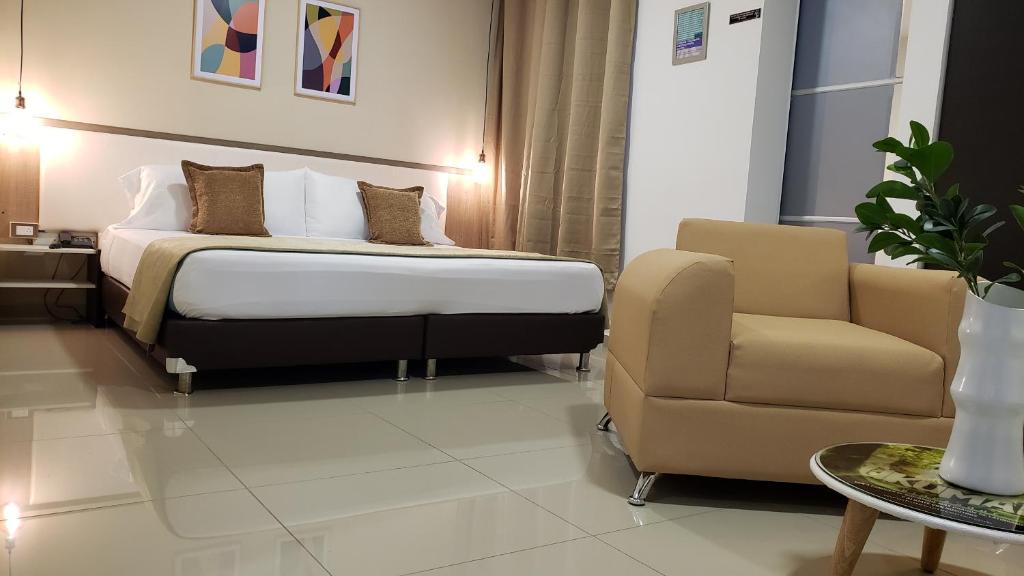 Postel nebo postele na pokoji v ubytování Hotel Suite Center Pereira