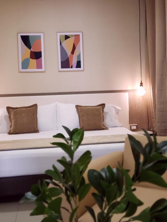 Postel nebo postele na pokoji v ubytování Hotel Suite Center Pereira