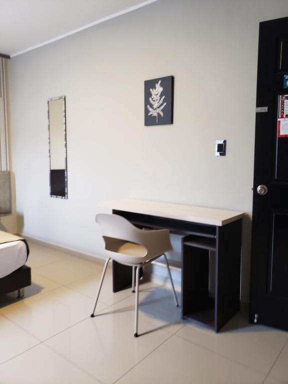 Posezení v ubytování Hotel Suite Center Pereira