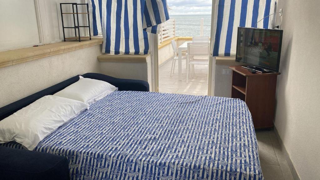 Postel nebo postele na pokoji v ubytování DiVino Appartamenti Vista Mare