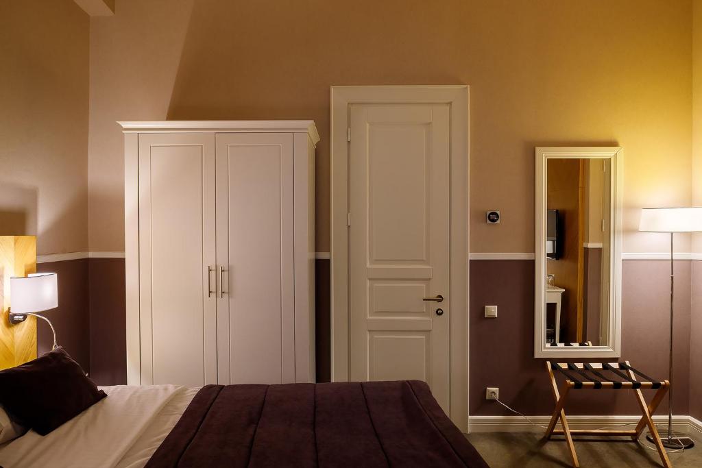 Postel nebo postele na pokoji v ubytování Modern Art Hotel