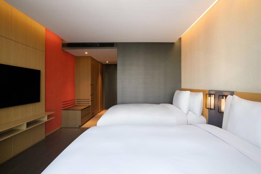 Postel nebo postele na pokoji v ubytování Courtyard by Marriott Suwon