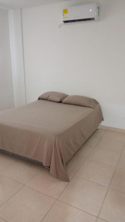 Postel nebo postele na pokoji v ubytování lujoso apartamento
