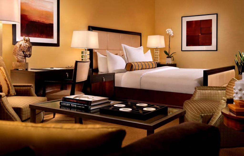 a hotel room with a bed and a desk at Trump International Hotel in Las Vegas