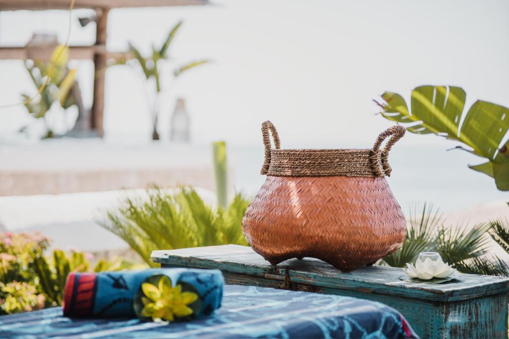 a basket sitting on top of a table at Empire Beach Resort ADULTS ONLY in Dhërmi