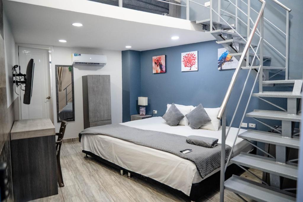 Bahia 79 Apartasuites Cerca al Centro客房内的一张或多张床位