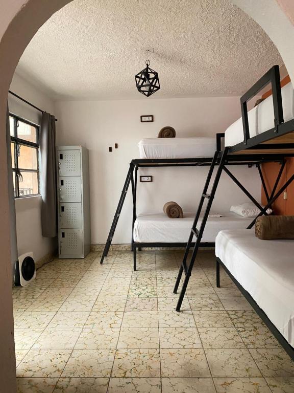 Postel nebo postele na pokoji v ubytování Lool Beh Hostal
