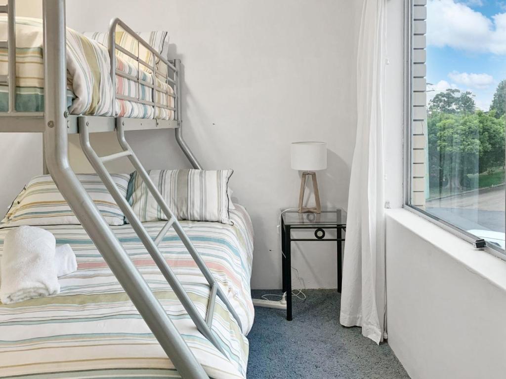 Postel nebo postele na pokoji v ubytování Laman Lodge Unit 5 15 Laman Street