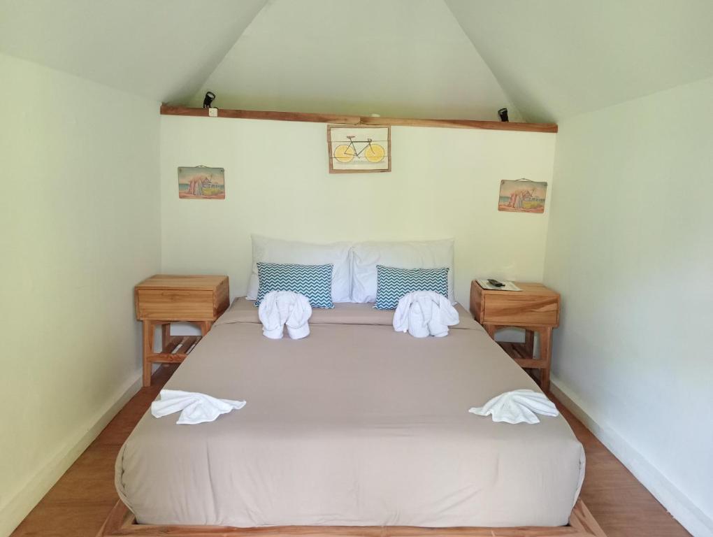 Rúm í herbergi á Sekumpul Bali Hidden Space
