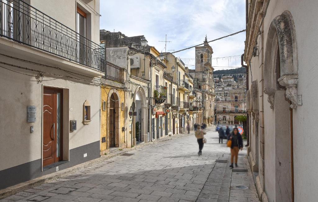 a group of people walking down a street at Stunning Apartment In Chiaramonte Gulfi With Wi-fi in Chiaramonte Gulfi