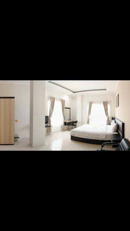 Postel nebo postele na pokoji v ubytování KHARIZ HOTEL