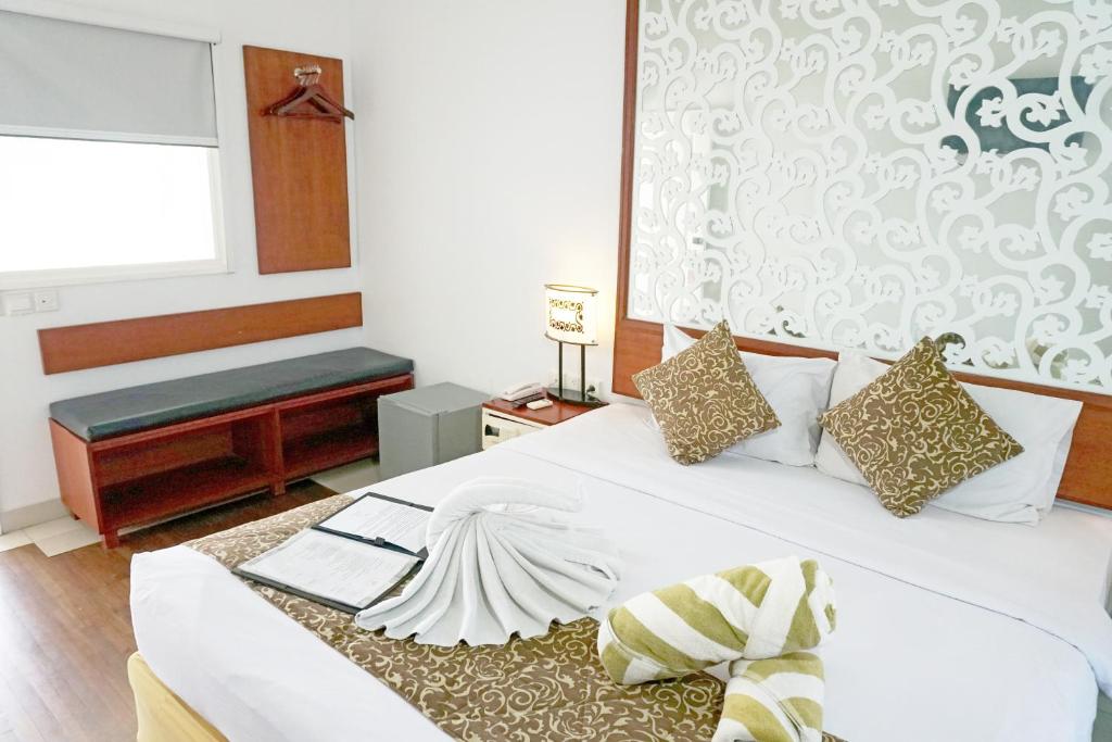 Postel nebo postele na pokoji v ubytování Samsara Inn