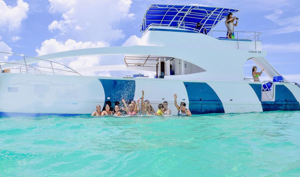 a group of people in the water on a boat at Adolfo in Punta Cana